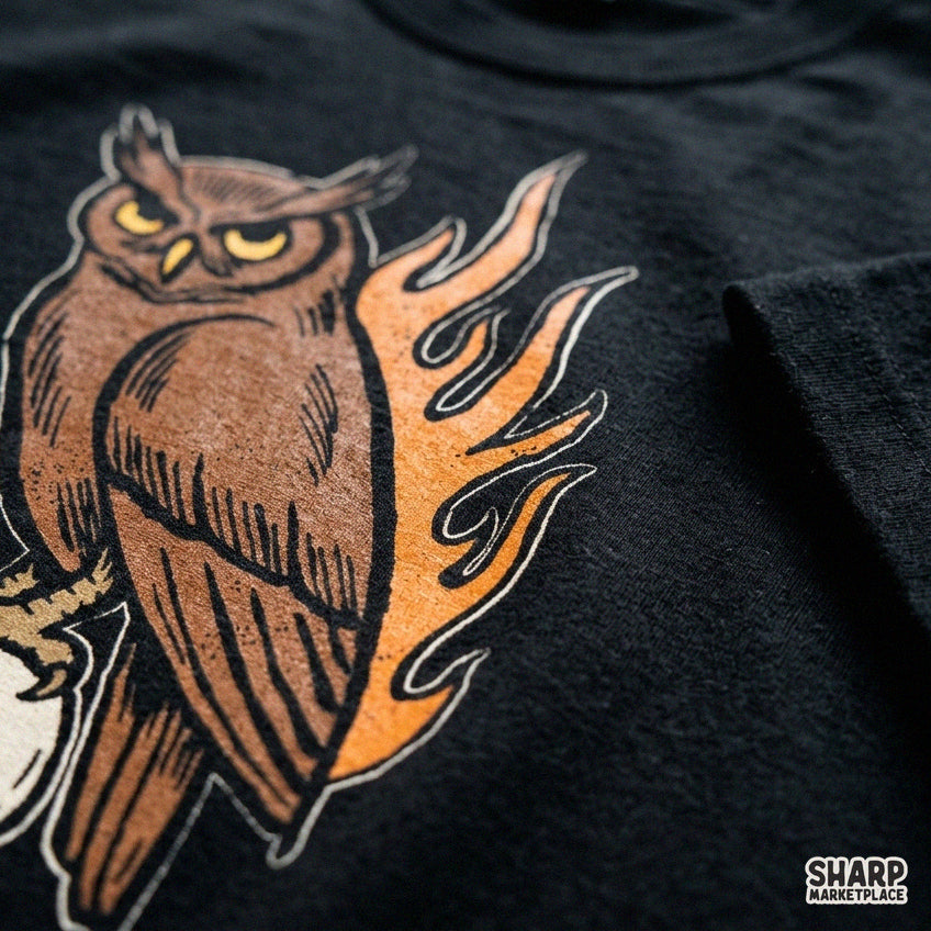 Gothic owl perched on a flaming skull PNG design for t-shirt sublimation and spooky Halloween streetwear