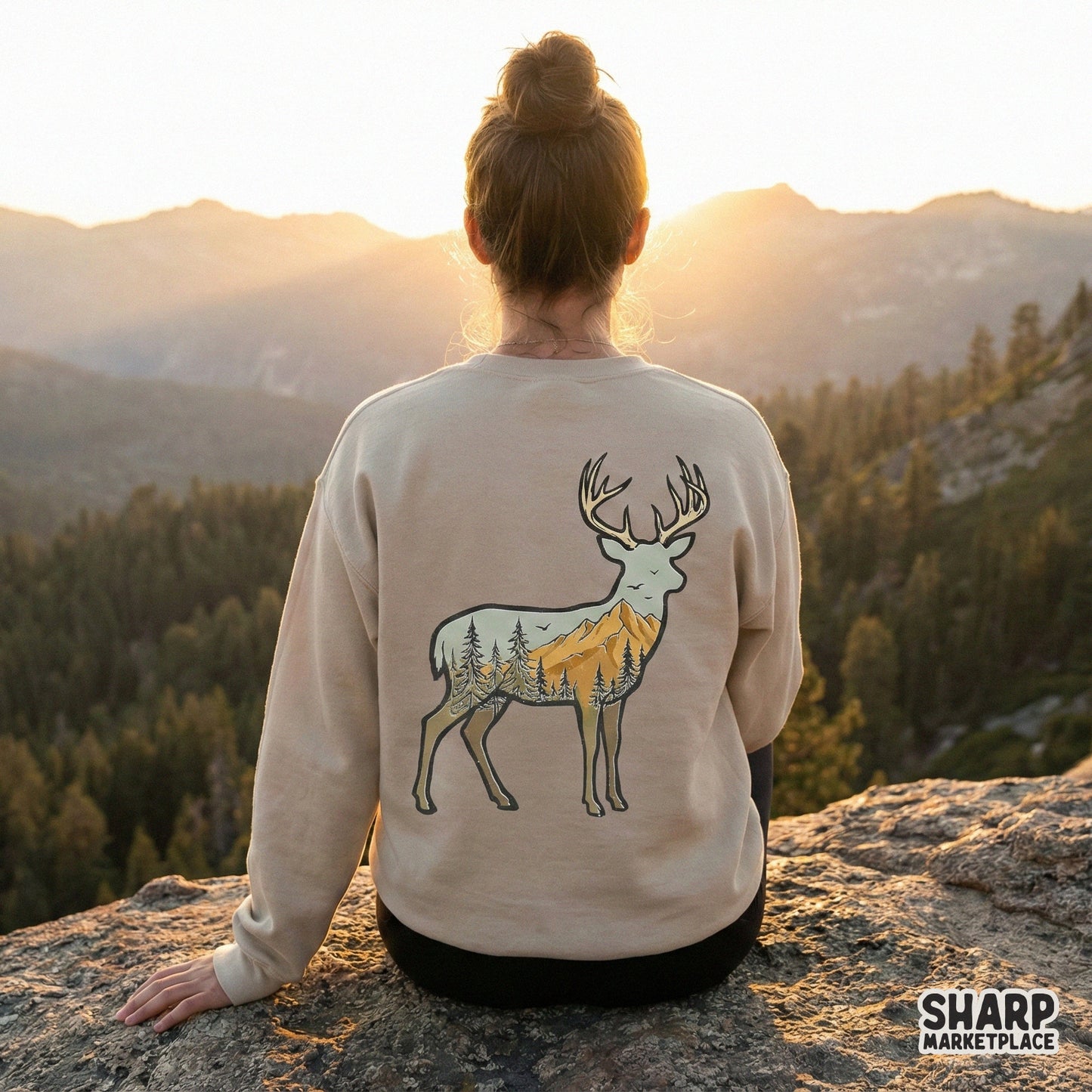 Hand-drawn woodland buck graphic with a mountain and pine tree scene, ideal for creating custom hiking apparel, tumblers, and outdoor-inspired gifts.