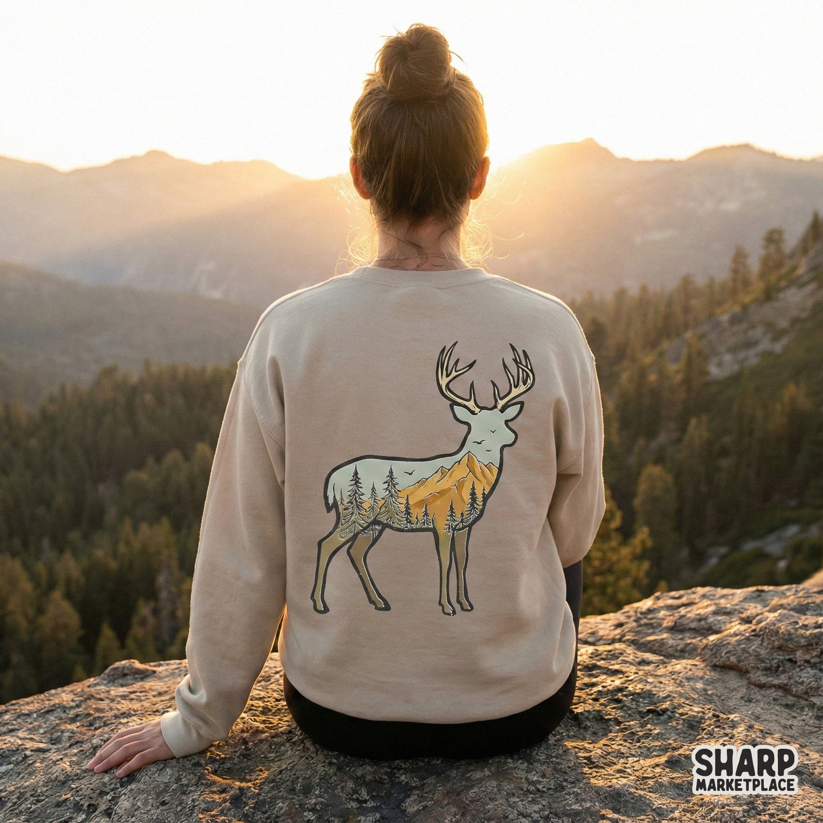 Hand-drawn woodland buck graphic with a mountain and pine tree scene, ideal for creating custom hiking apparel, tumblers, and outdoor-inspired gifts.