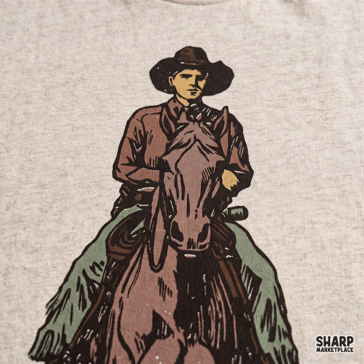 Hand drawn cowboy riding horse PNG graphic with vintage western style for t-shirts and country apparel