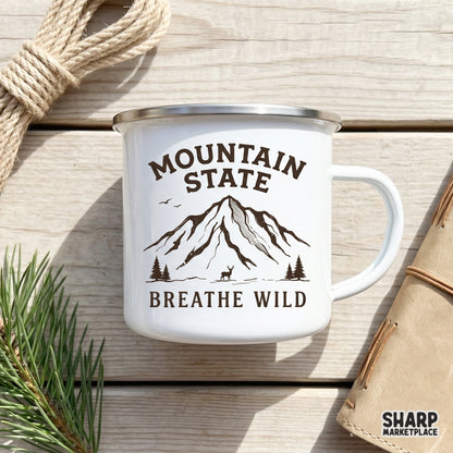 Hand-drawn alpine mountain scene with a deer silhouette and the words Mountain State Breathe Wild in a vintage brown style for print-on-demand.