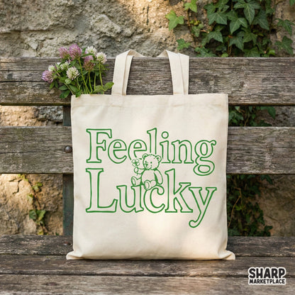Festive green monochromatic line art graphic of a teddy bear with a clover and the words Feeling Lucky, ideal for custom tumblers and holiday shirts.