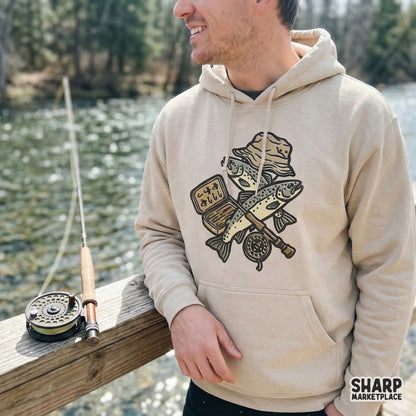High-resolution fishing gear PNG featuring a fly fishing reel and trout, ideal for creating custom tumblers, stickers, and vintage-style apparel.
