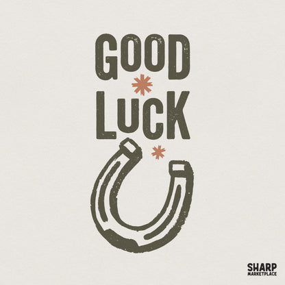 Vintage Good Luck text graphic with a distressed horseshoe illustration, earthy olive green and burnt orange colors, perfect for retro apparel designs.