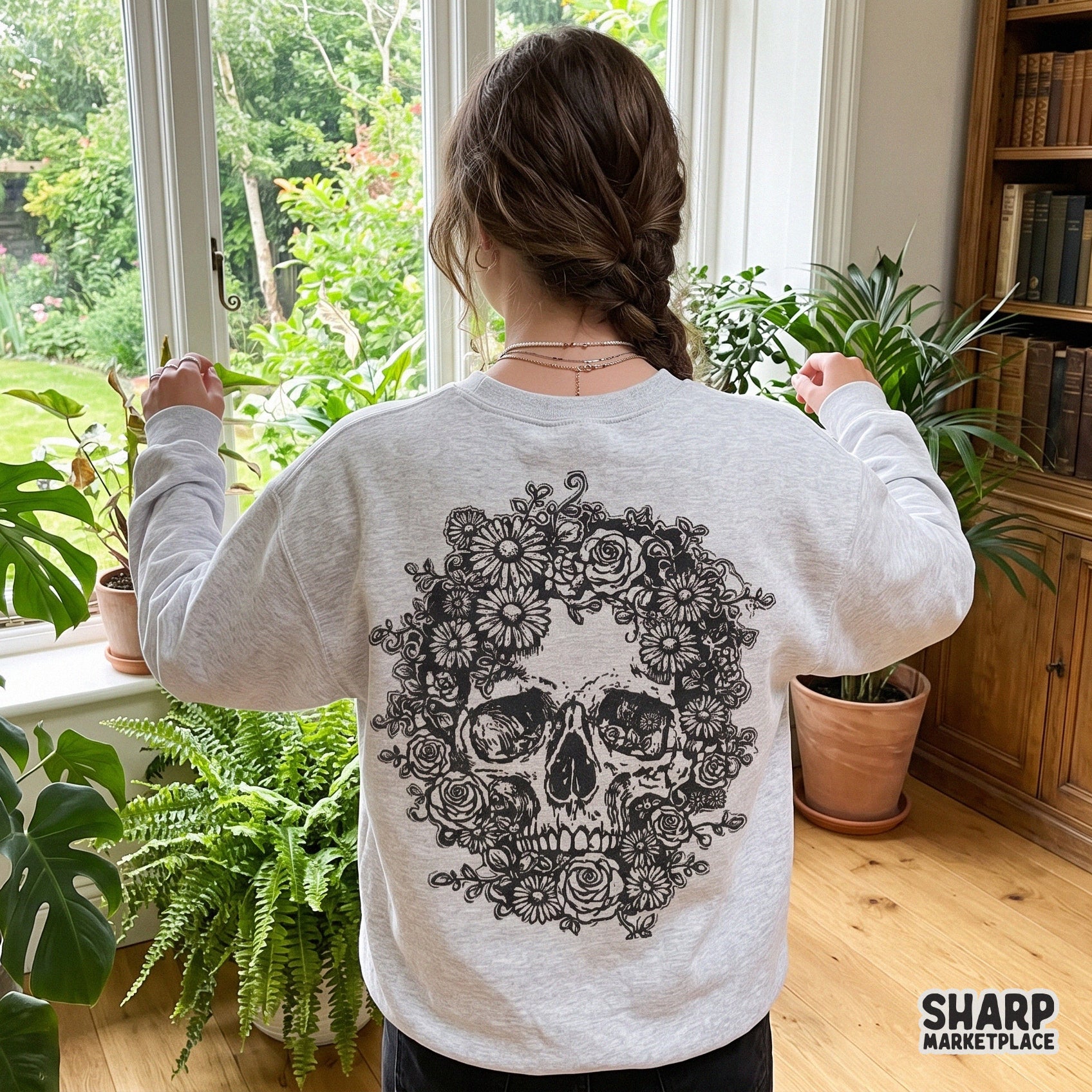 Detailed floral skull with roses and daisies in a gothic garden style for Halloween shirt sublimation designs
