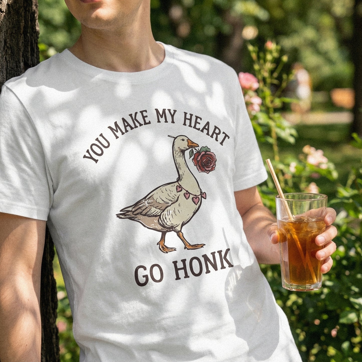 Vintage-style goose graphic with a rose and heart necklace, accompanied by the playful quote You Make My Heart Go Honk for apparel and print projects.