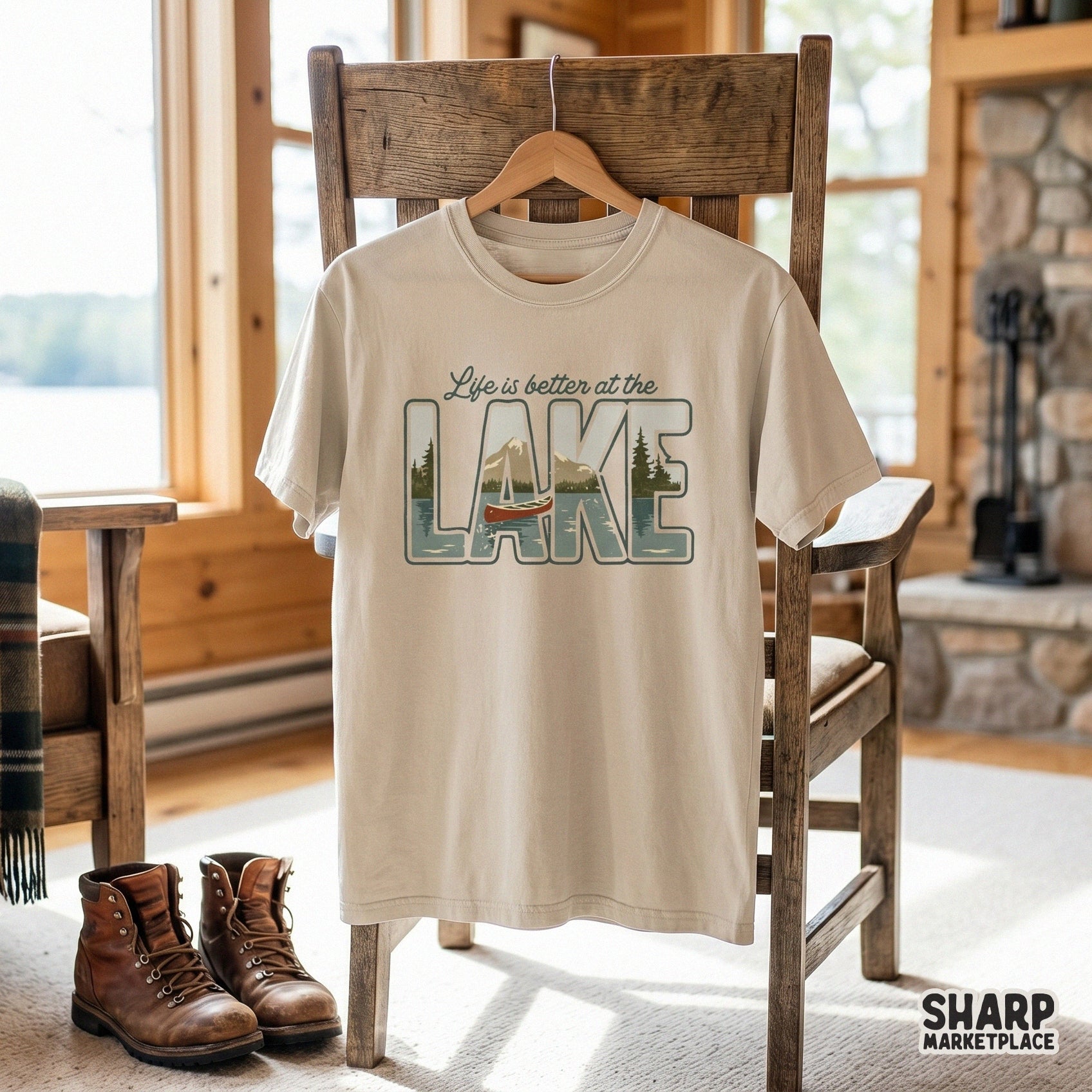 Digital sublimation graphic showing a scenic mountain lake and canoe inside the word LAKE, perfect for summer apparel, stickers, or cabin decor.