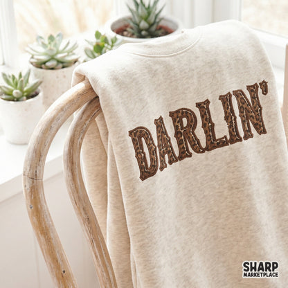 Trendy southern cowgirl Darlin graphic with distressed brown outlines, suitable for sublimation printing on shirts, mugs, and home decor items.