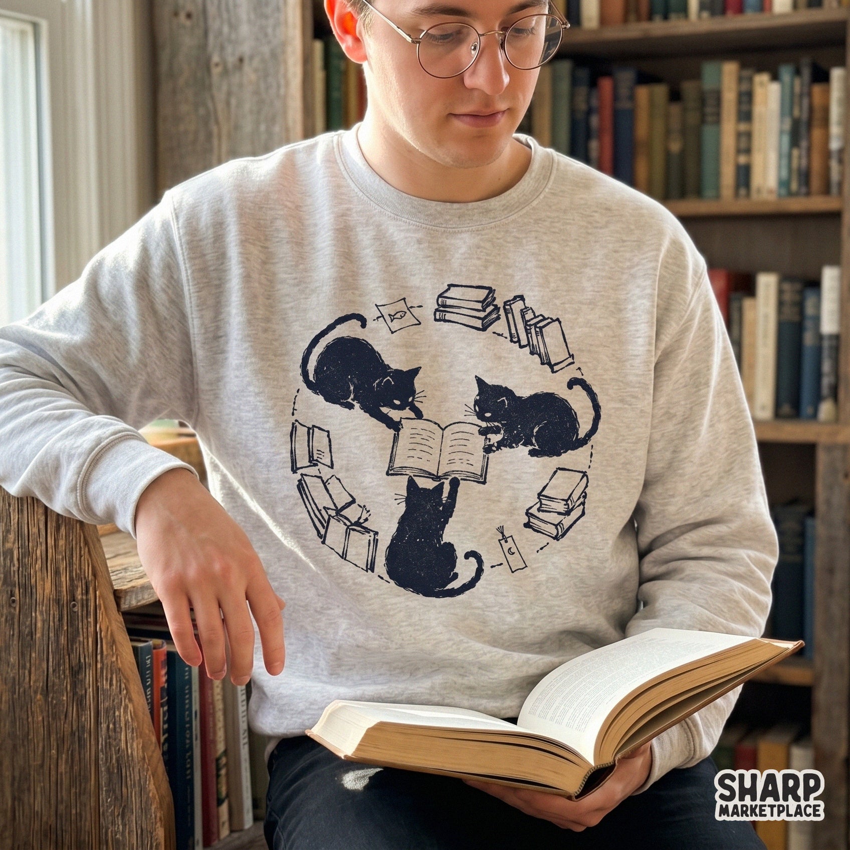 Cozy library-themed graphic featuring three black cats reading, rendered in a clean sketch style for DIY sublimation projects and book lover gifts.