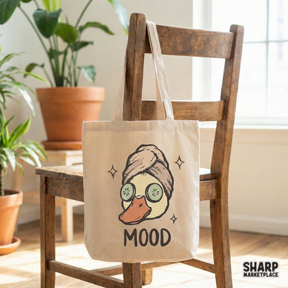 Relaxing duck cartoon with cucumber slices and a towel wrap, featuring distressed MOOD text for a charming self-care themed printable art project.