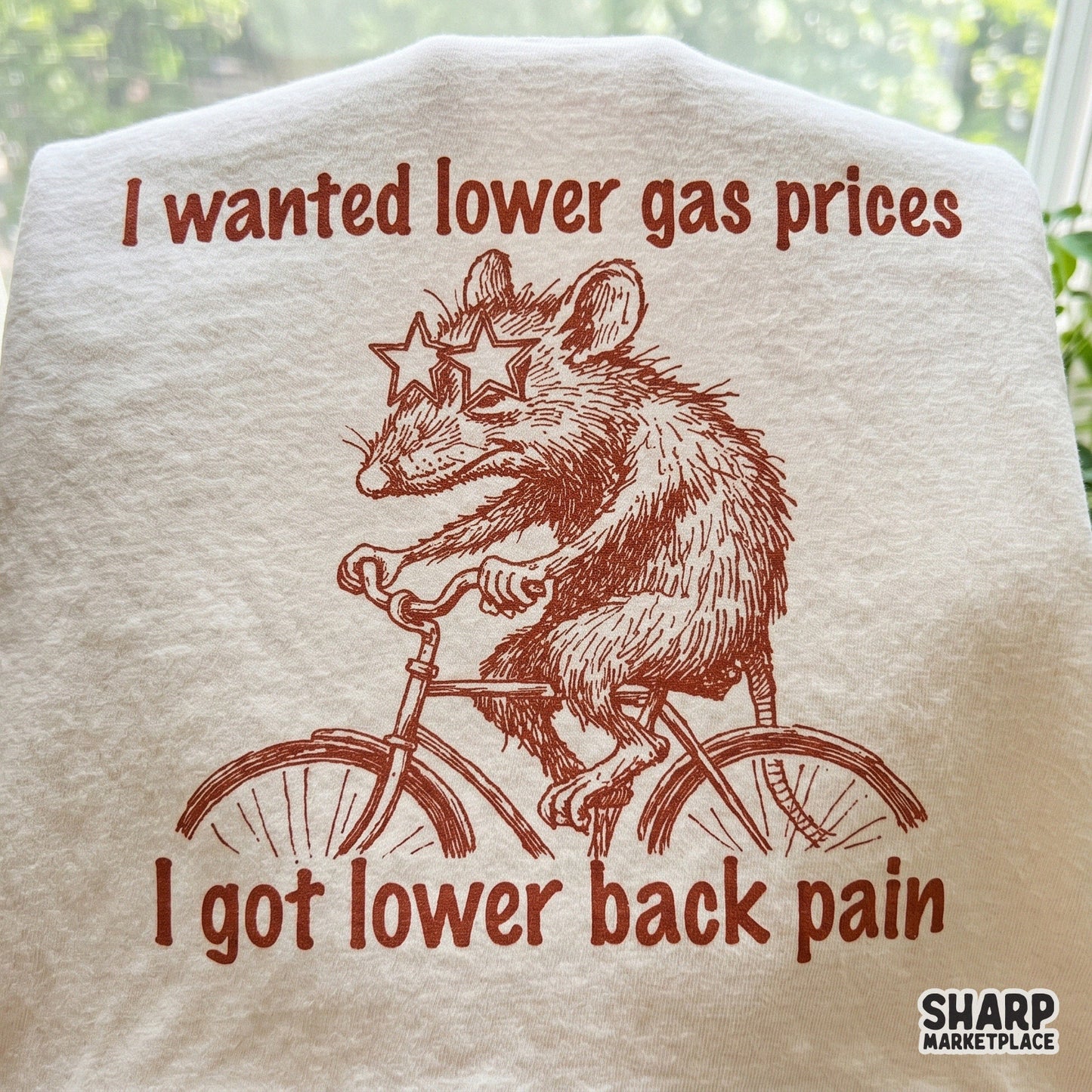 Digital download design featuring a hand-drawn possum in star glasses riding a bicycle with retro typography for funny t-shirts and sublimation projects.