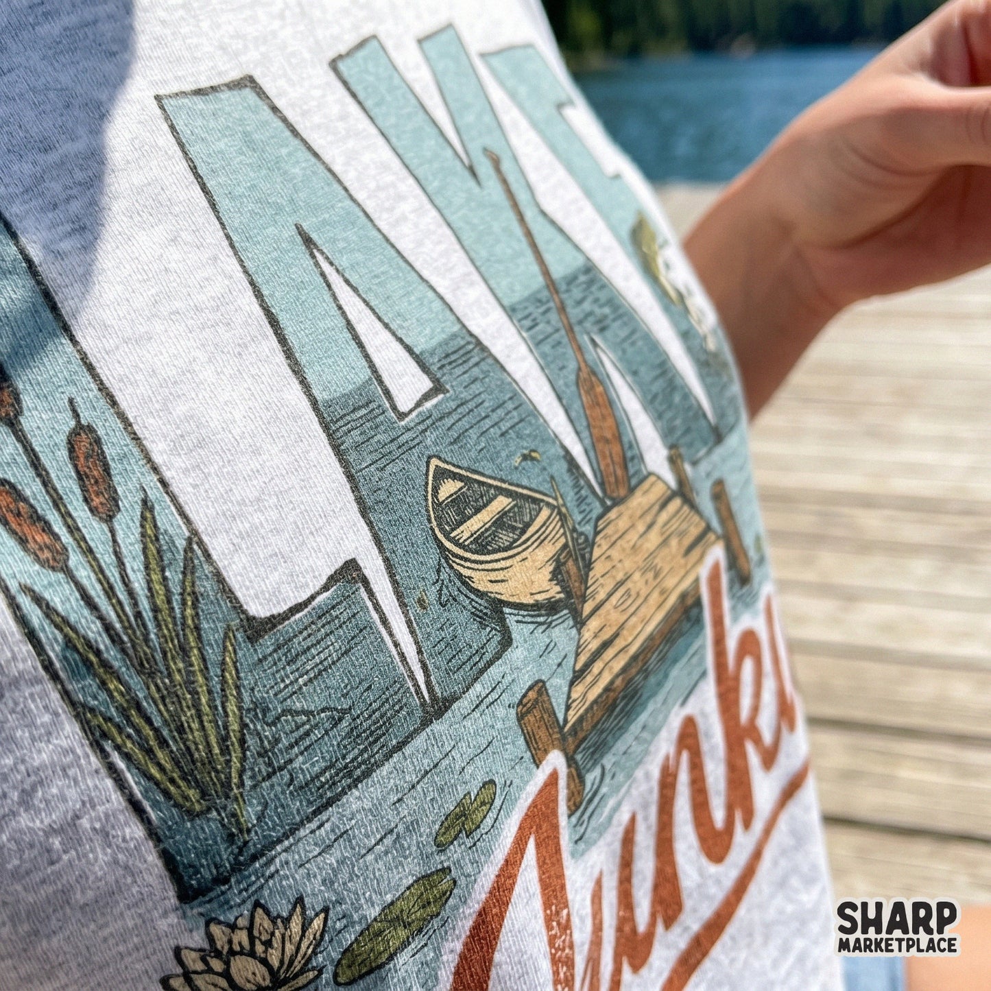 Detailed Lake Junkie digital artwork with a retro aesthetic, featuring a peaceful dock and bass fish for DIY summer vacation shirts and crafts.