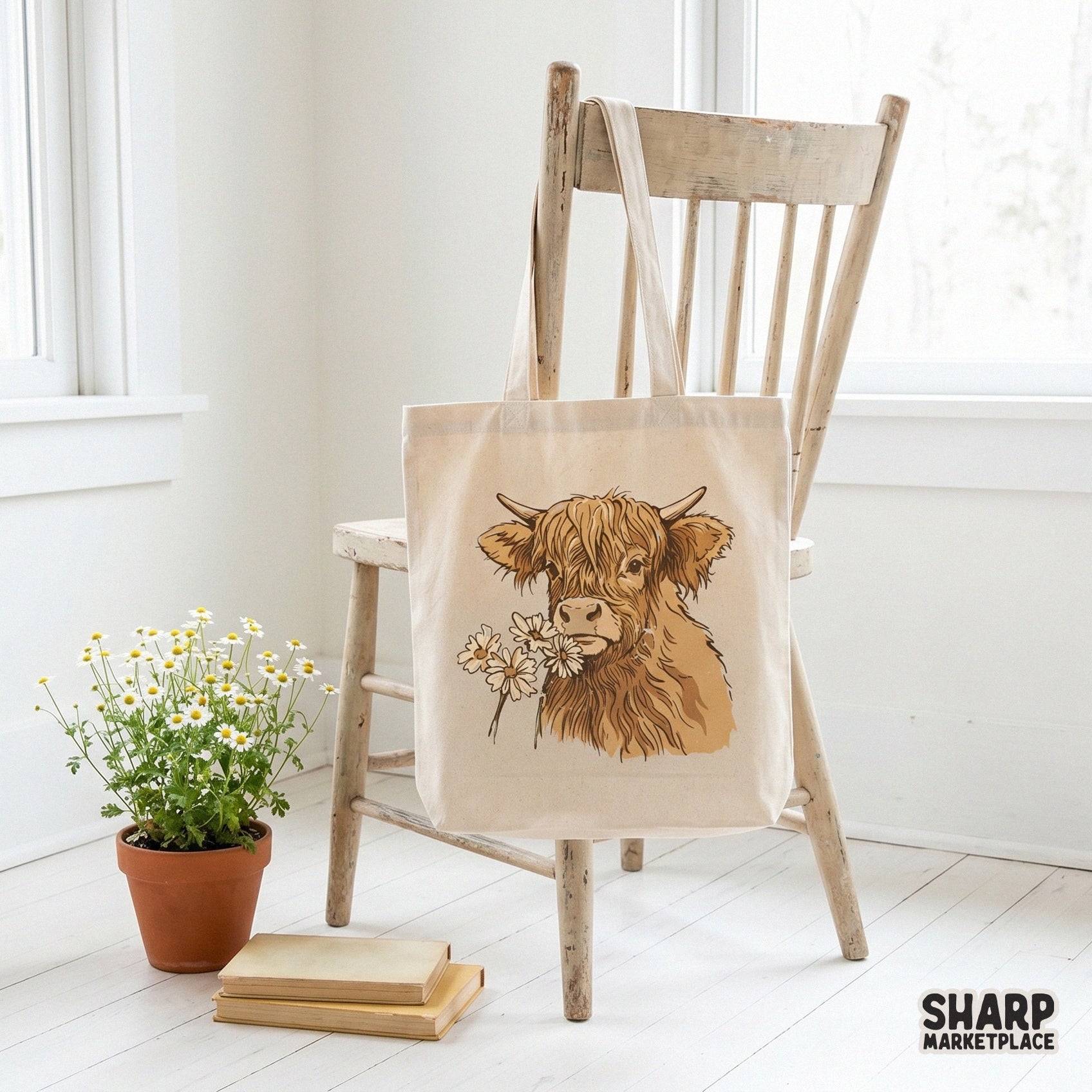 Tote bag mockup featuring a rustic Highland cow portrait with daisies, perfect for western-themed DIY projects and custom apparel.