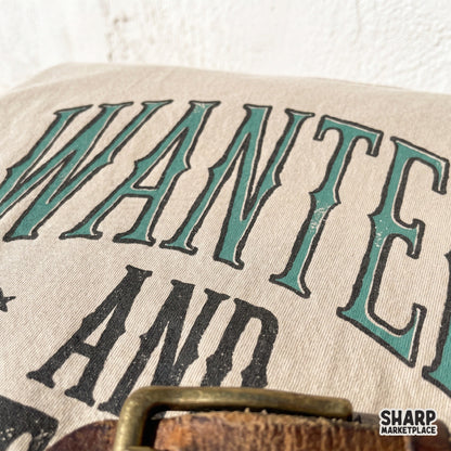 Rustic western design with Wanted and Untamed lettering in earth tones, suitable for high-quality sublimation printing on oversized tees and tumblers.