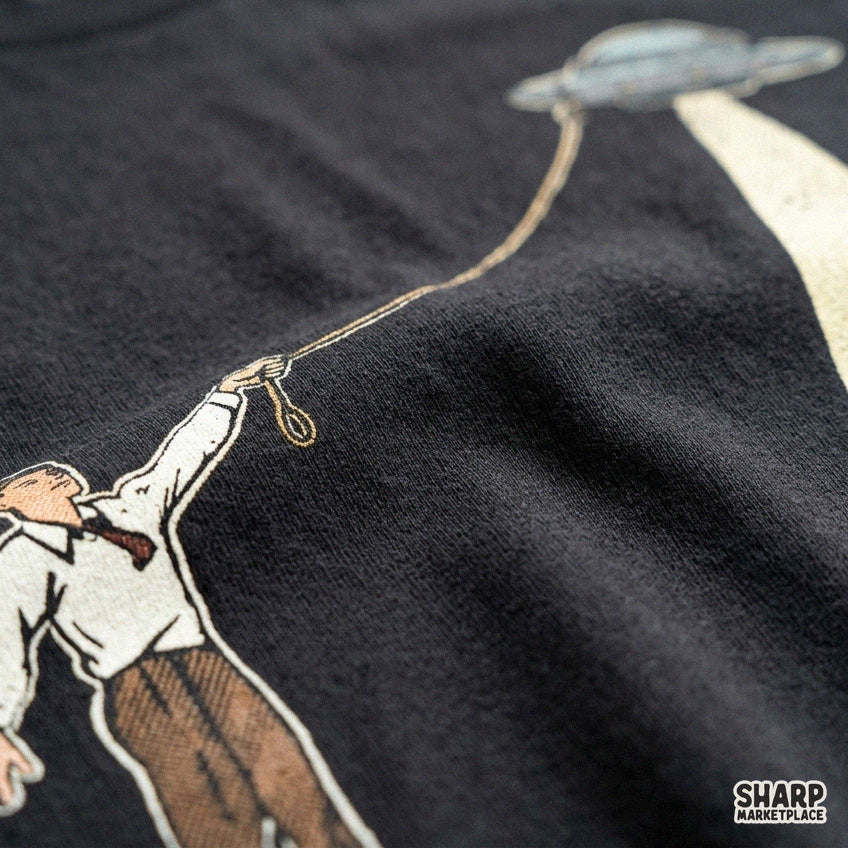 Retro vintage cowboy catching a UFO spaceship with a lasso in a funny sci-fi western PNG design for t-shirts