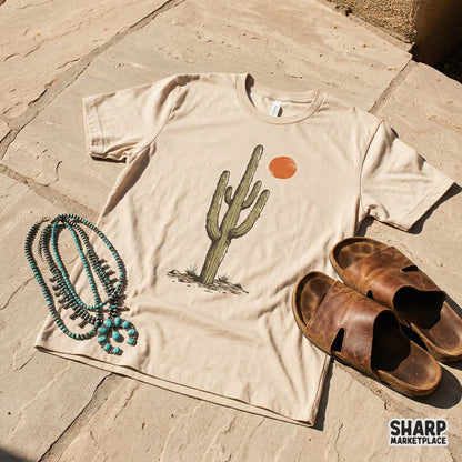 Textured sage green saguaro cactus and orange sun illustration, a versatile digital file for creating custom western apparel and nature wall art.