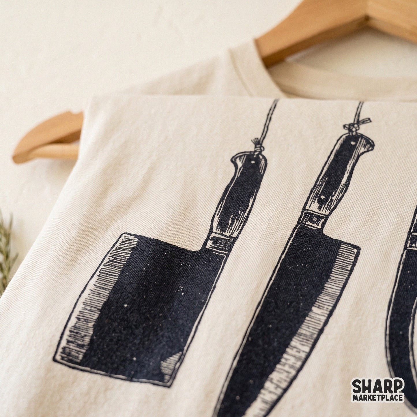 Hanging butcher knives in a retro dark art style for true crime and horror themed Halloween shirt designs