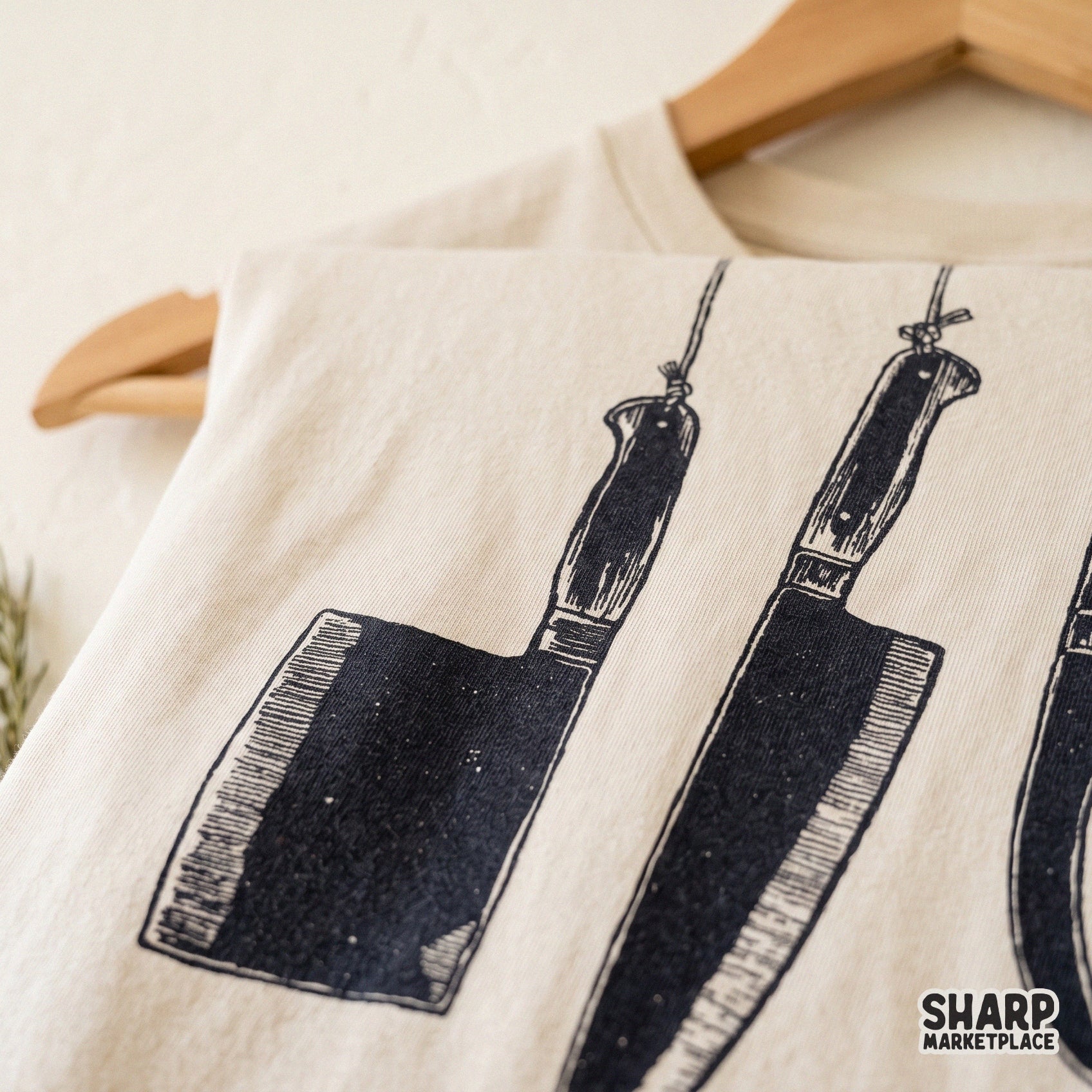 Hanging butcher knives in a retro dark art style for true crime and horror themed Halloween shirt designs