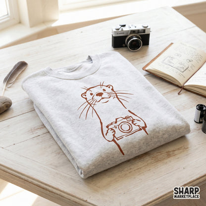 Charming otter holding a camera illustration in a simple line art style, suitable for high-quality sublimation transfers and nature-inspired wall art.