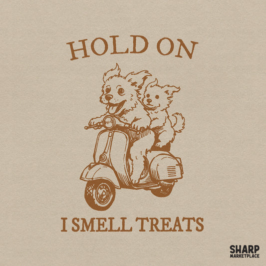 Vintage brown monochromatic digital design featuring two happy dogs riding a retro scooter with the text Hold On I Smell Treats.