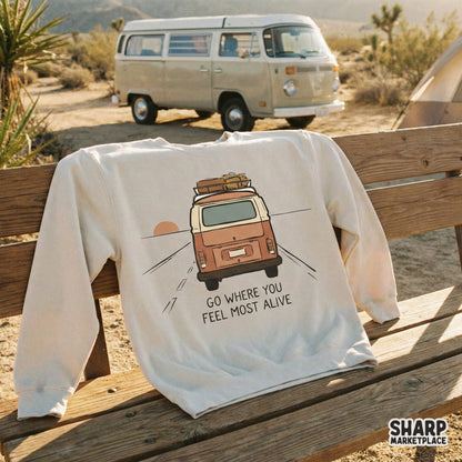 Digital design of a retro camper van on a road trip, displayed on a cream-colored sweatshirt, perfect for sublimation and custom apparel.