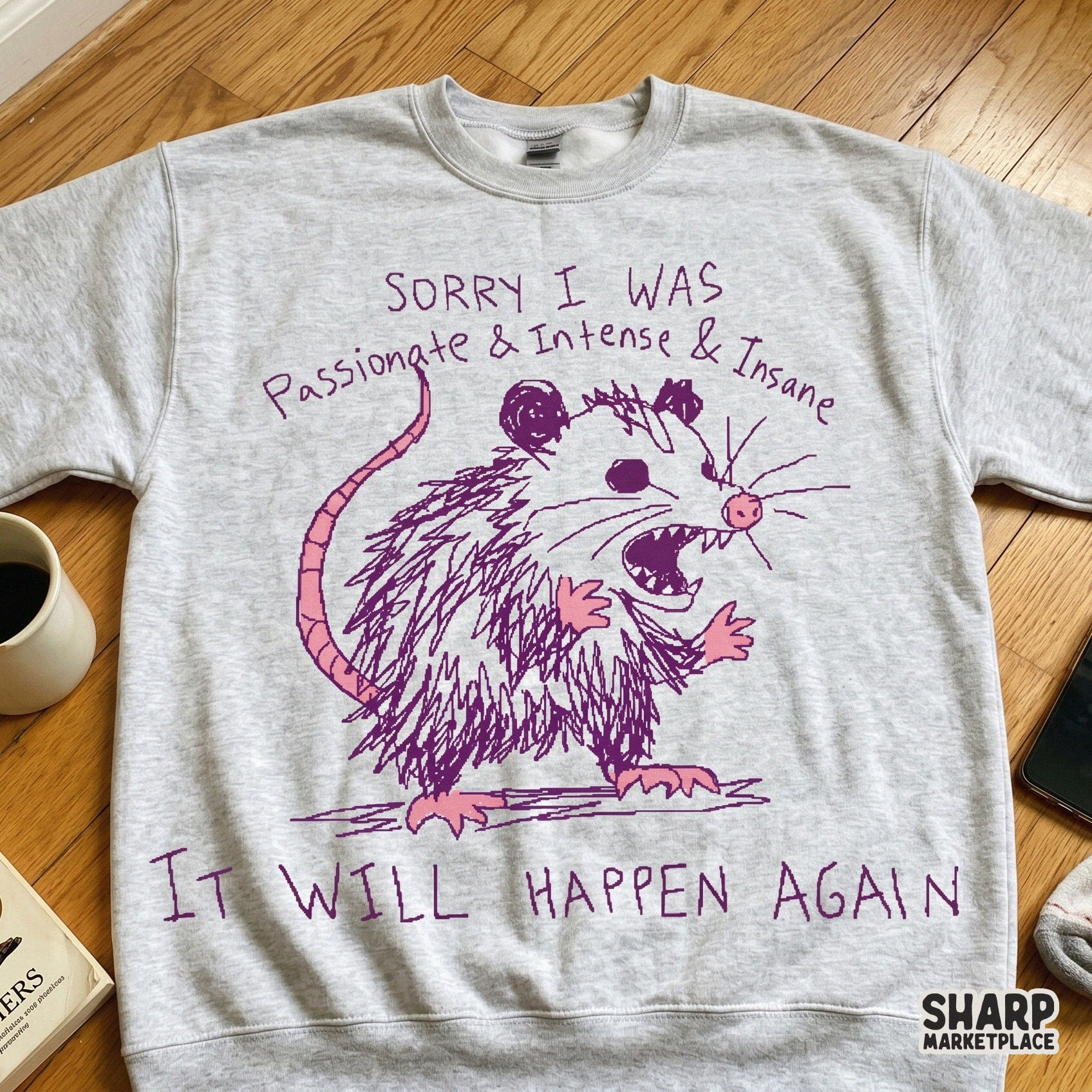 Funny opossum sublimation graphic printed on a grey sweatshirt, featuring a chaotic purple hand-drawn marsupial sketch and sarcastic text for trendy streetwear.