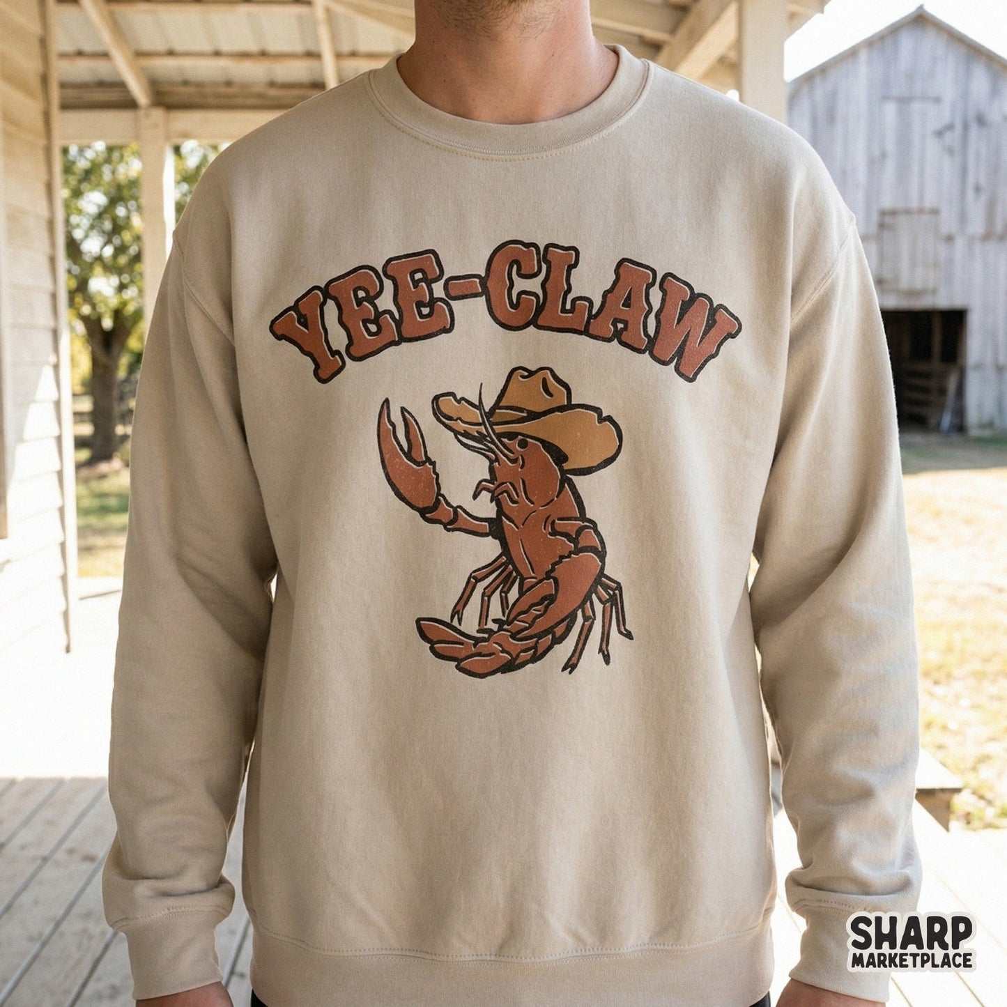 A vintage-style illustration of a cowboy crawfish with the punny phrase Yee-Claw, perfect for coastal rodeo themed t-shirts and summer stickers.