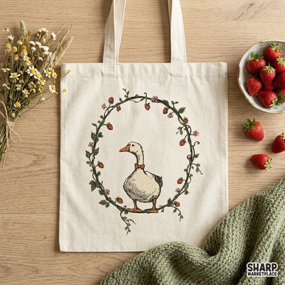 Cute goose wearing a red bowtie inside a strawberry wreath cottagecore sublimation PNG design for spring apparel