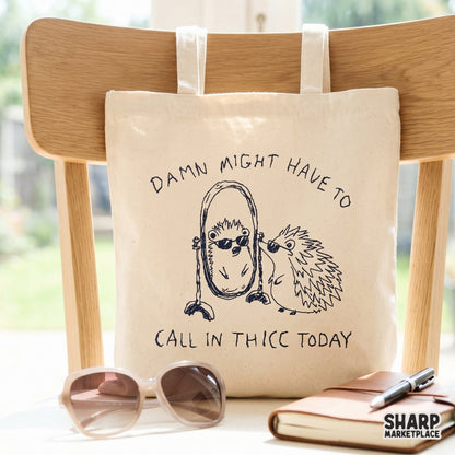 Printable graphic of a round hedgehog in sunglasses with the witty phrase Damn Might Have To Call In Thicc Today, rendered in a distressed blue ink style.