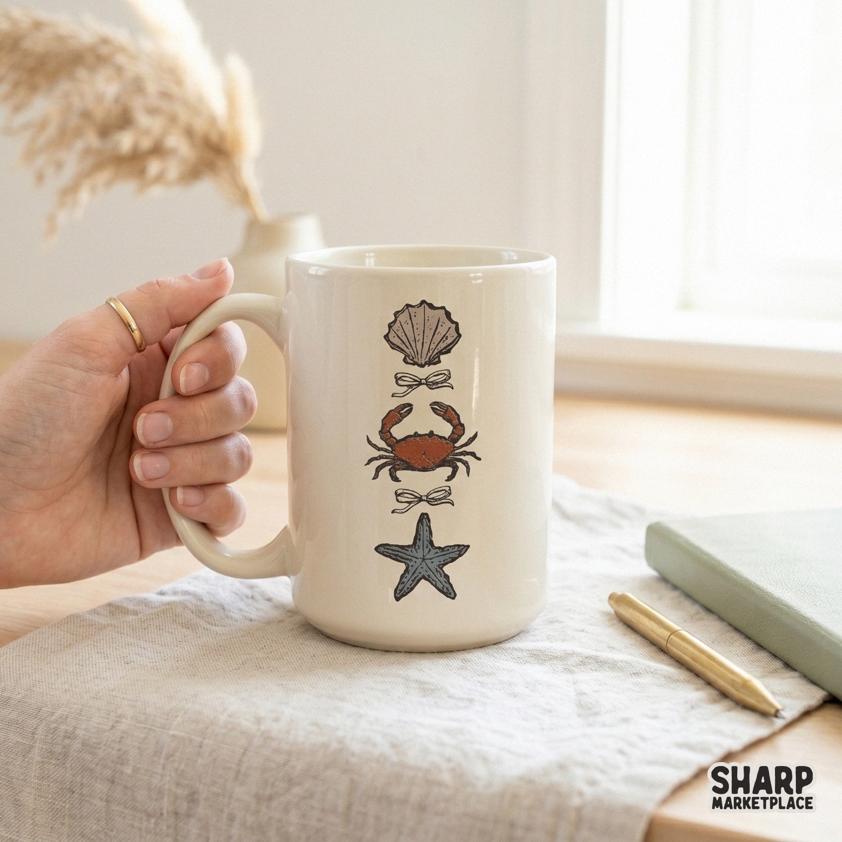 Coastal aesthetic PNG design with a stacked seashell, crab, and starfish illustration, perfect for beach-themed t-shirts and summer DIY projects.