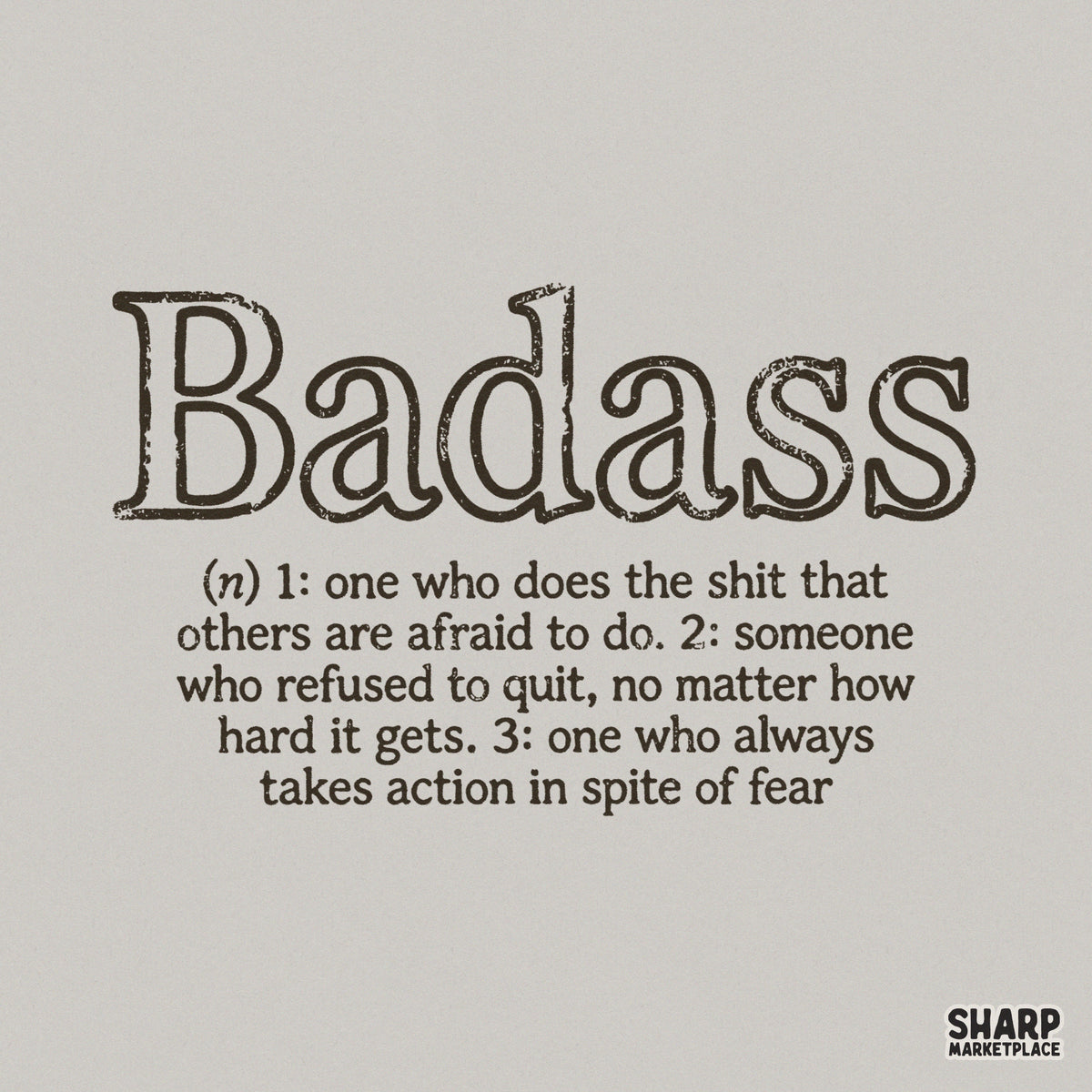 Distressed typewriter font typography defining the word Badass with three empowering meanings, presented as a clean black graphic on a light background.