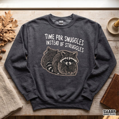Funny raccoon meme PNG design with Time For Snuggles Instead Of Struggles text for shirts, stickers, and sublimation