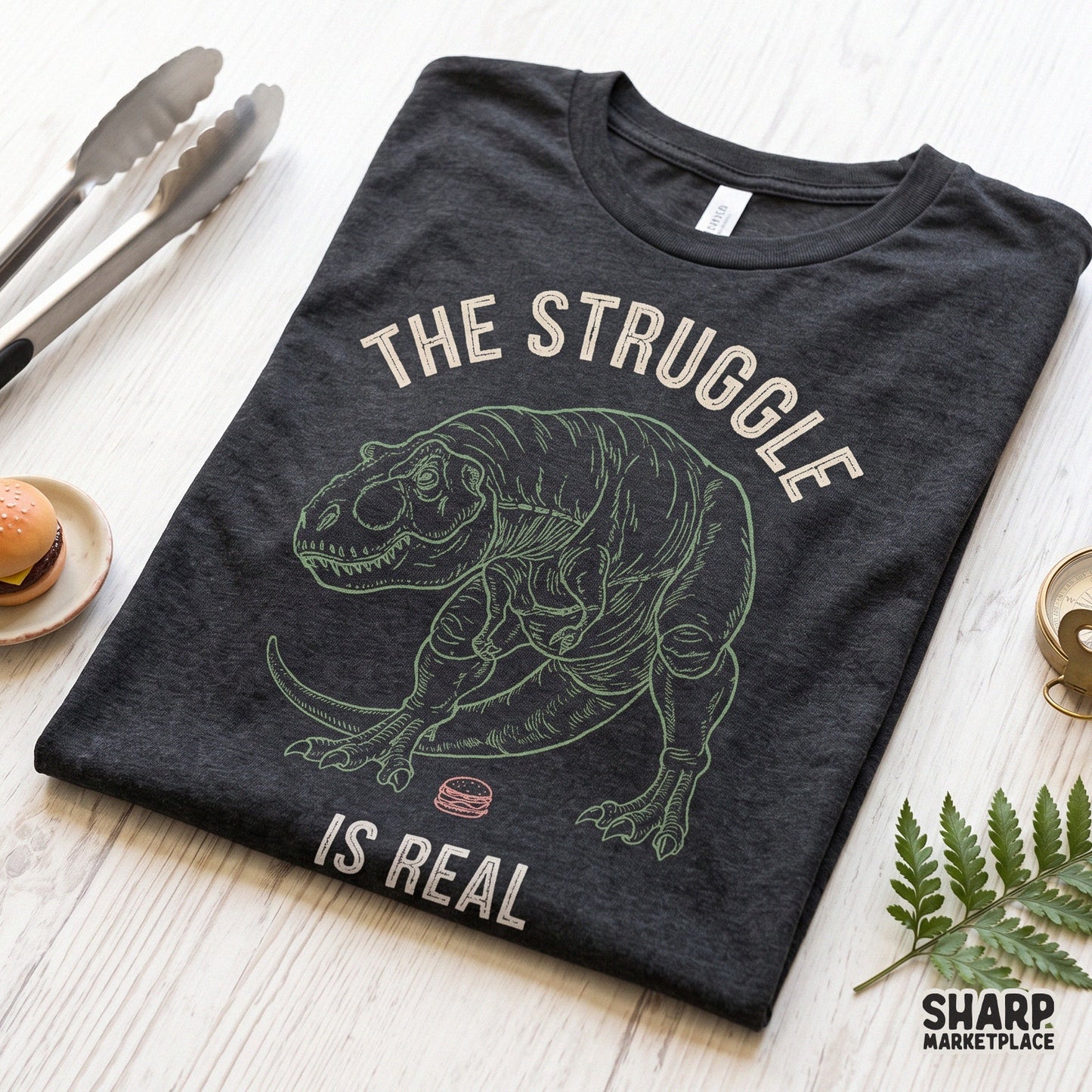 Sarcastic T-Rex dinosaur with short arms reaching for a burger in a funny retro PNG design for sublimation and apparel