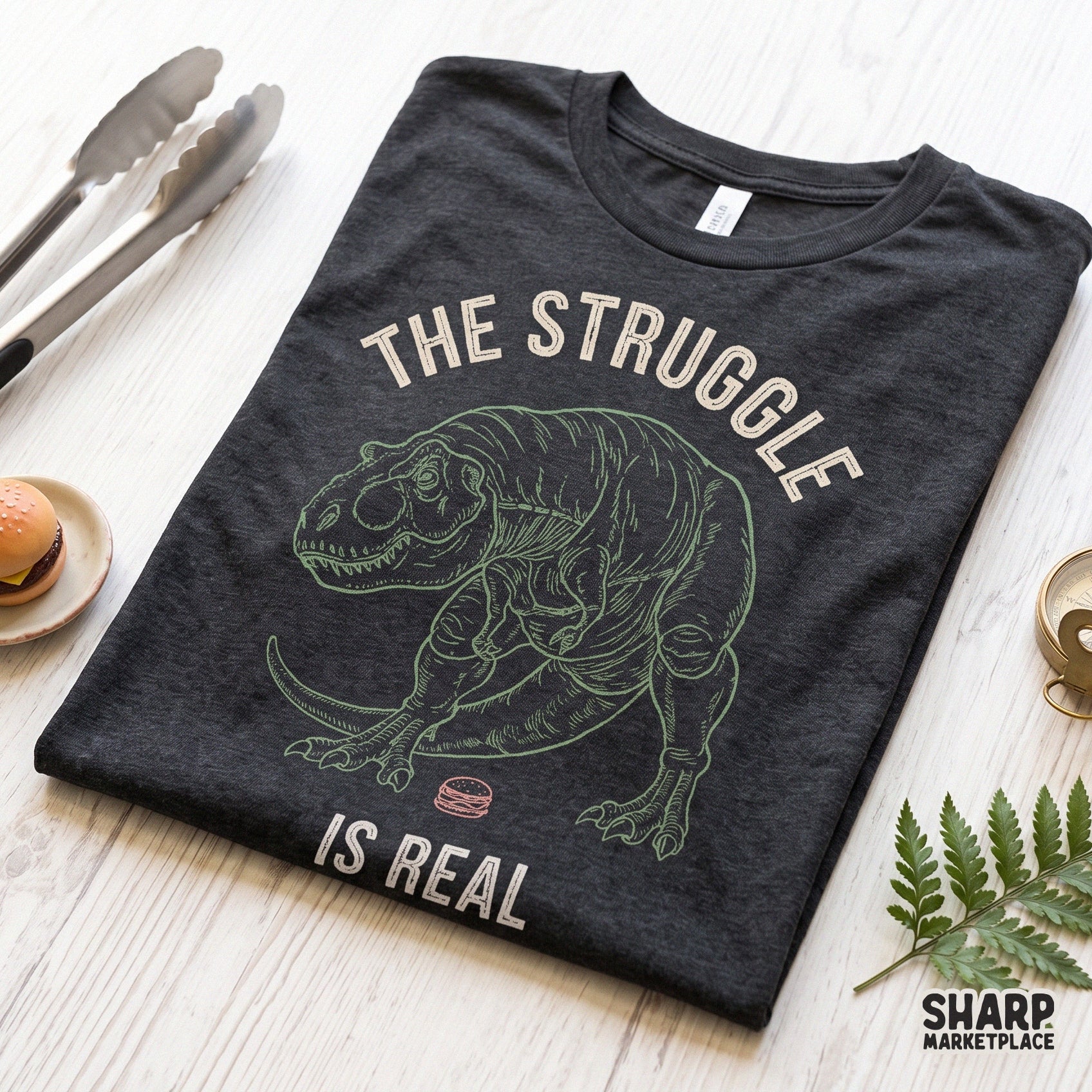 Sarcastic T-Rex dinosaur with short arms reaching for a burger in a funny retro PNG design for sublimation and apparel