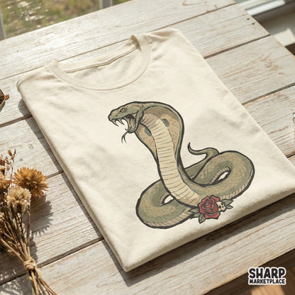 Vintage tattoo style cobra illustration with a red rose and skull, displayed on a cream colored t-shirt for a gothic fashion or sublimation project.