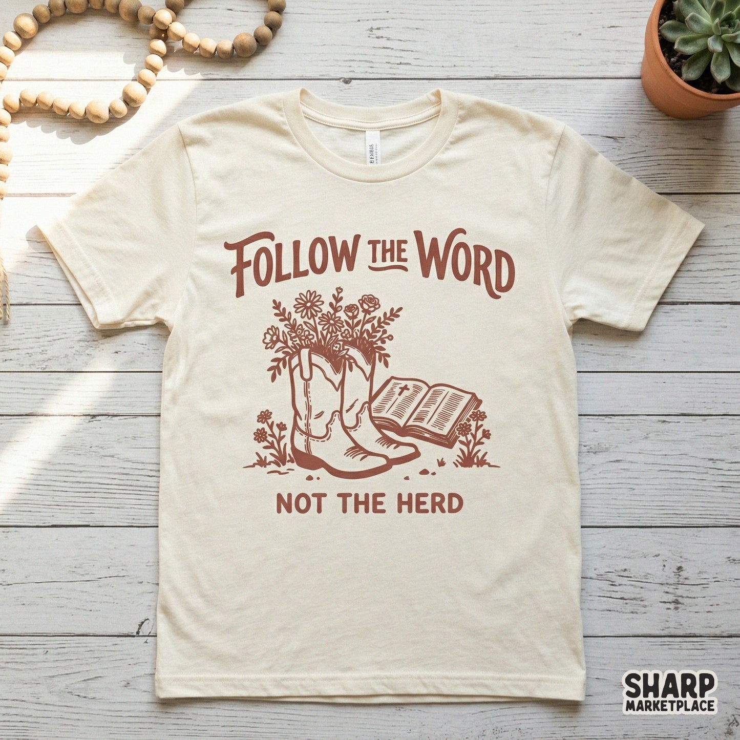 Western style Christian sublimation design in monochromatic brown showing cowboy boots with flowers and a Bible for apparel and DIY projects.