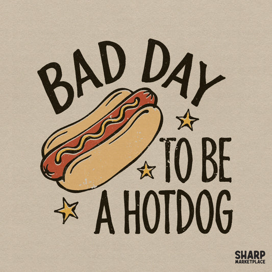 Retro-style digital design featuring a grilled hotdog with mustard and the sarcastic text Bad Day To Be A Hotdog, accented with yellow stars.