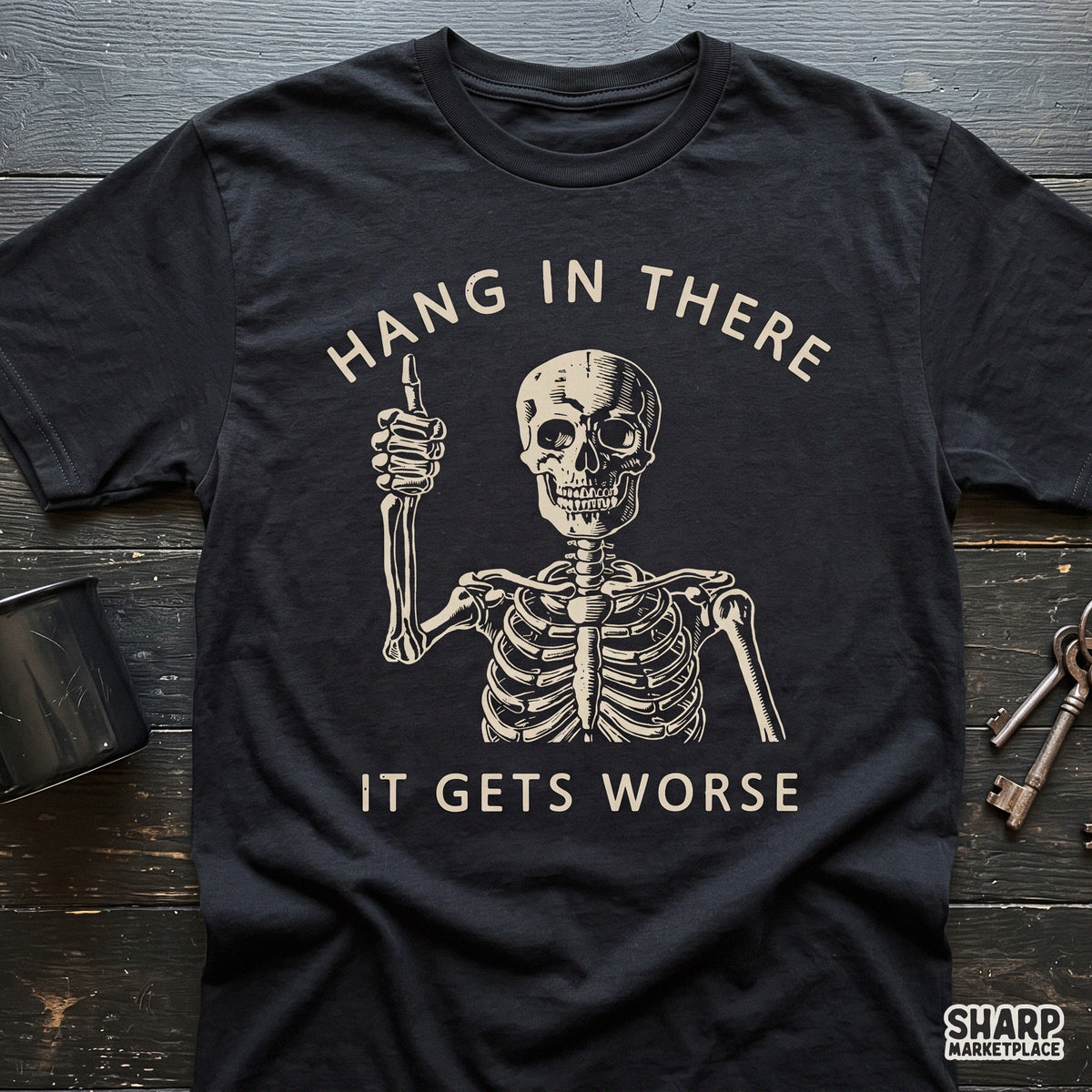 Sarcastic skeleton giving a thumbs up with Hang In There It Gets Worse quote retro dark humor shirt PNG design