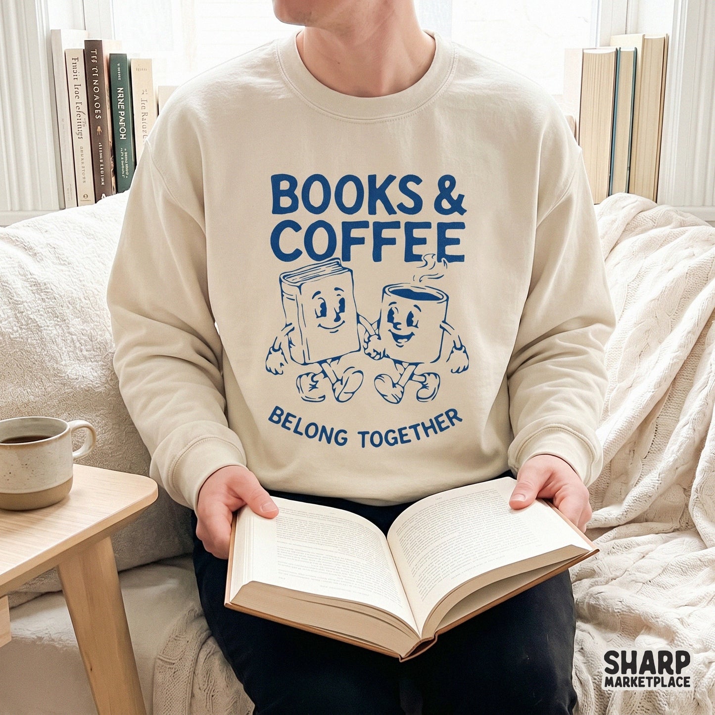 Printable sublimation design for book lovers featuring a distressed blue graphic of a smiling book and coffee mug with the phrase Books and Coffee Belong