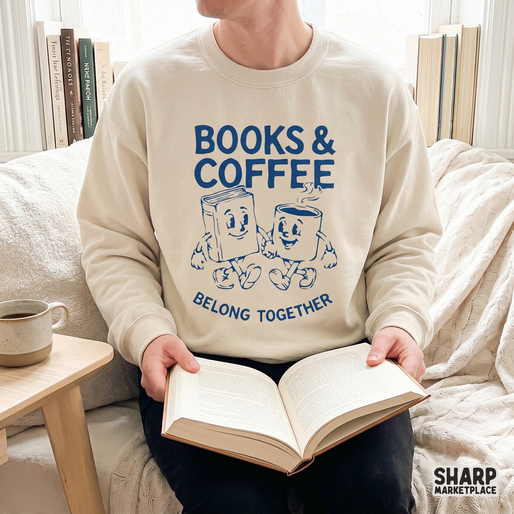 Printable sublimation design for book lovers featuring a distressed blue graphic of a smiling book and coffee mug with the phrase Books and Coffee Belong
