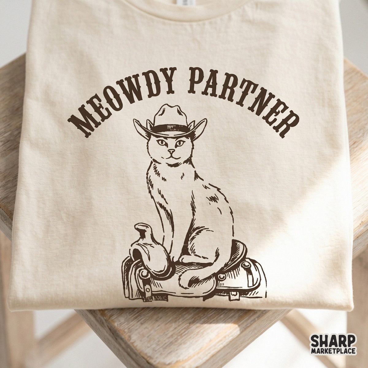 Western rodeo themed digital download featuring a cat in a cowboy hat on a saddle, suitable for sublimation transfers and custom apparel designs.
