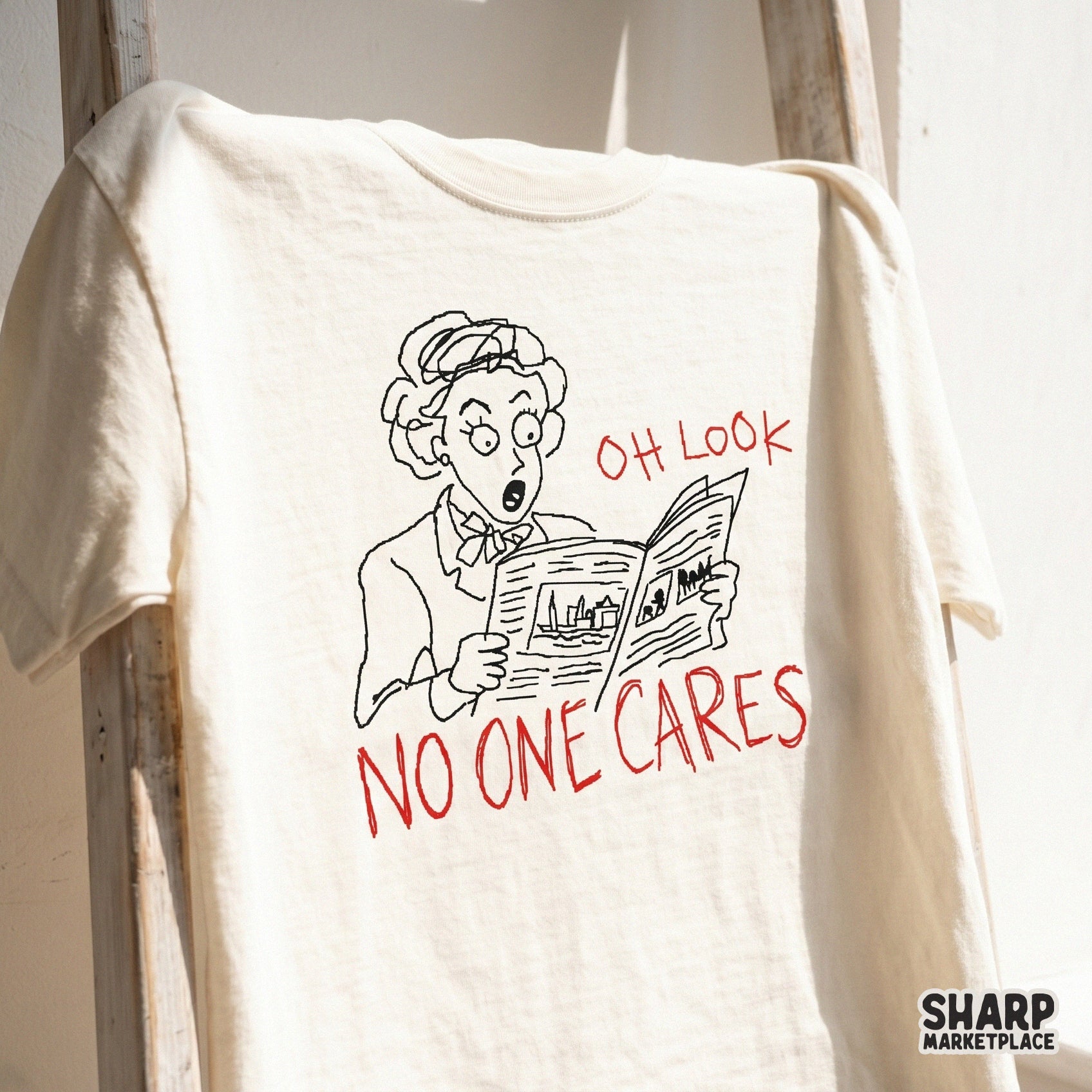 Funny digital design featuring a retro-style sketch of a woman reading a newspaper with the sassy quote Oh Look No One Cares in bold red lettering.