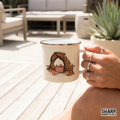 Retro western desert rock arch illustration printed on a white camping mug, showcasing a warm sunset scene perfect for sublimation and apparel.