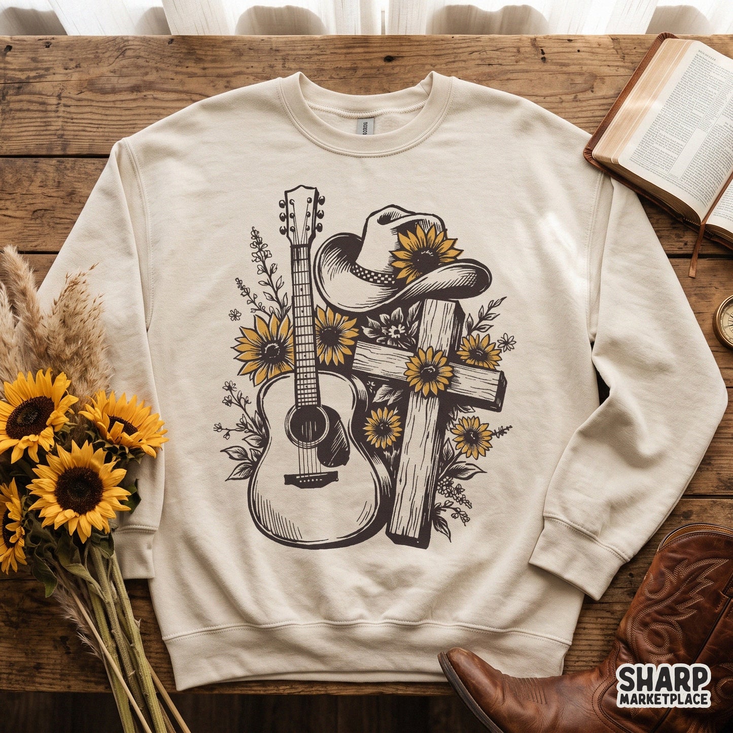 Hand drawn acoustic guitar with a wooden cross, cowboy hat, and retro sunflowers for a country music shirt design