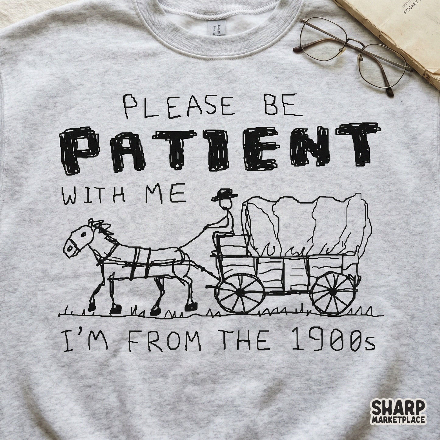 Monochrome western-themed graphic with a hand-drawn wagon and horse, perfect for creating humorous stickers, apparel, or retro-style DIY crafts.