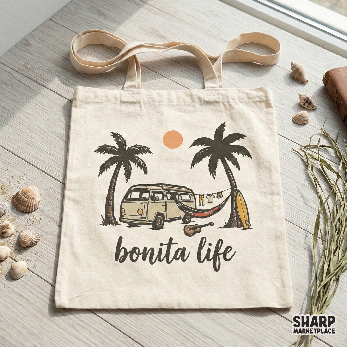 Tote bag mockup displaying a coastal summer graphic with a retro van, hammock, and palm trees under a warm orange sun, captioned Bonita Life.