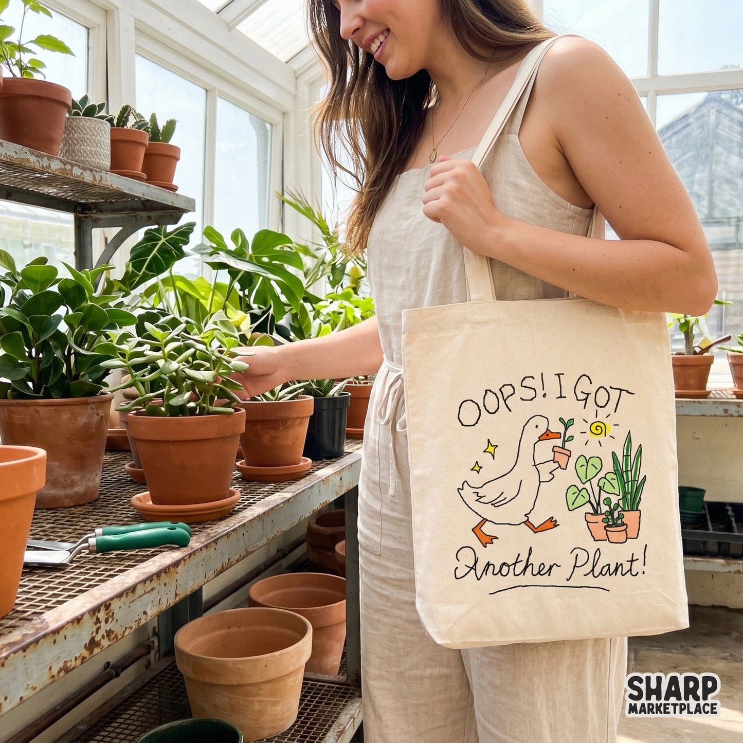 Digital design of a cute goose holding a plant with the quote Oops! I Got Another Plant! surrounded by a sun, stars, and potted greenery.