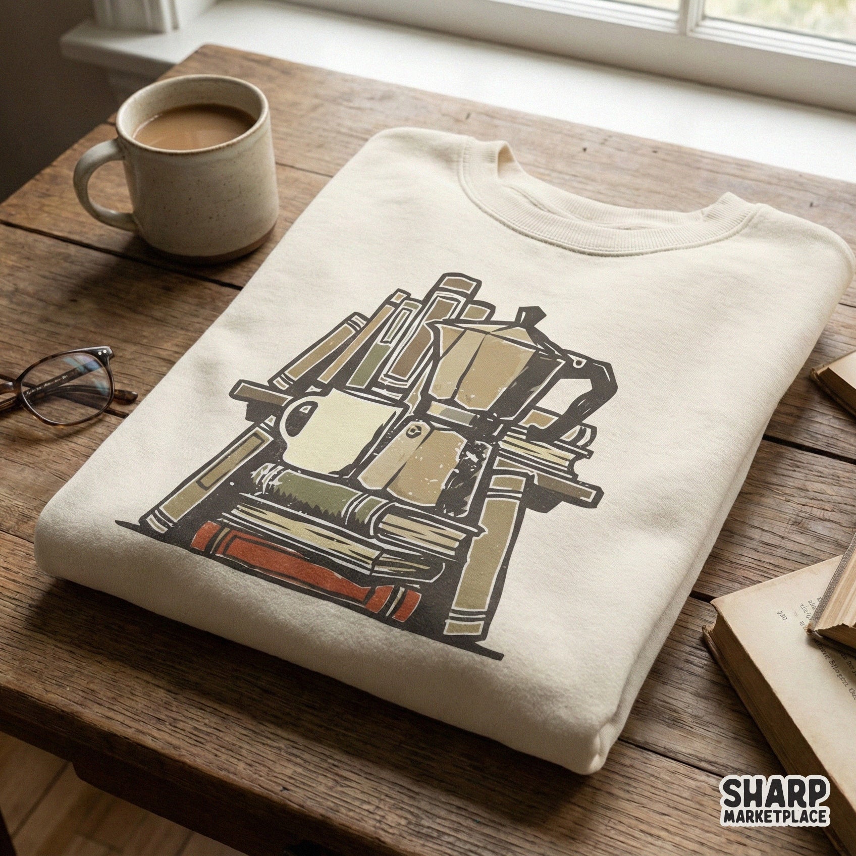 Cozy reading design featuring a stack of weathered books and a moka pot, displayed as a printable graphic for custom t-shirts and hoodies.
