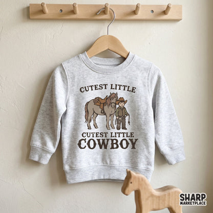 A light gray toddler sweatshirt mockup displaying a vintage-style graphic of a little boy and his horse with western-themed text for apparel printing.