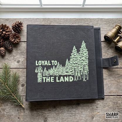 Vintage forest explorer PNG featuring pine trees and binoculars graphic for retro outdoor camping shirts